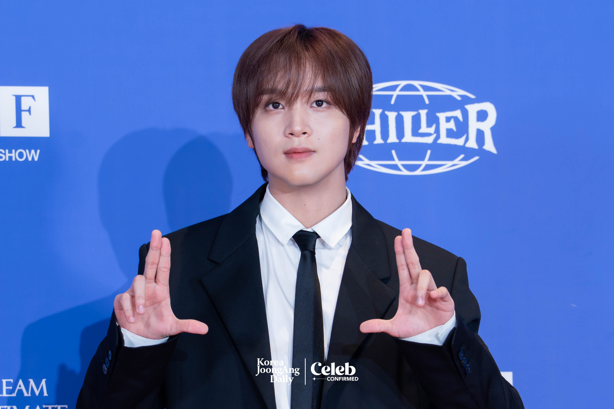 NCT Dream’s Haechan poses for photos during a news conference for the release of the band's fifth full-length album, “Go Back to the Future,” at Lotte Cinema World Tower in southern Seoul on July 14. [DANIELA GONZALEZ PEREZ]