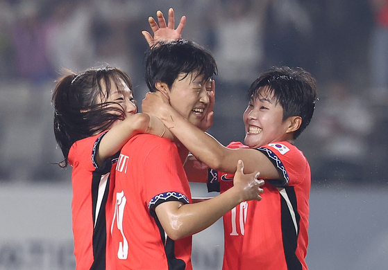 Jeong Da-bin of Korea, center, is congratulated by teammates Jang Selgi, left, and Ji So-yun after scoring against Japan during the teams' second match of the East Asian Football Federation E-1 Women's Football Championship at Hwaseong Stadium in Hwaseong, Gyeonggi, on July 13. [YONHAP] 