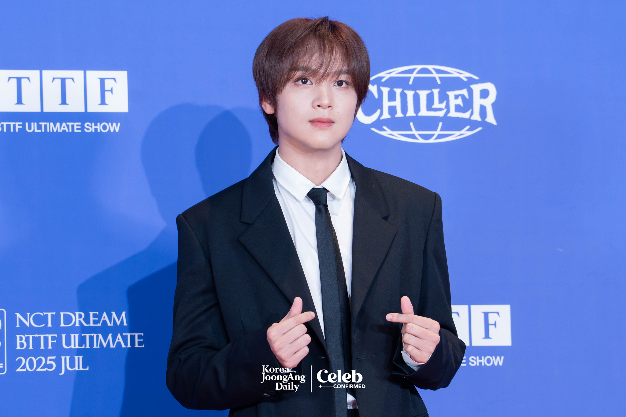 NCT Dream’s Haechan poses for photos during a news conference for the release of the band's fifth full-length album, “Go Back to the Future,” at Lotte Cinema World Tower in southern Seoul on July 14. [DANIELA GONZALEZ PEREZ]
