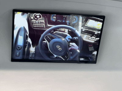 A monitor inside the self-driving village bus shows the steering wheel moving on its own in real-time. [CHO JUNG-WOO]