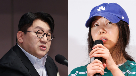 Bang Si-hyuk, chairman of HYBE at left, and Min Hee-jin, former CEO of ADOR [YONHAP]