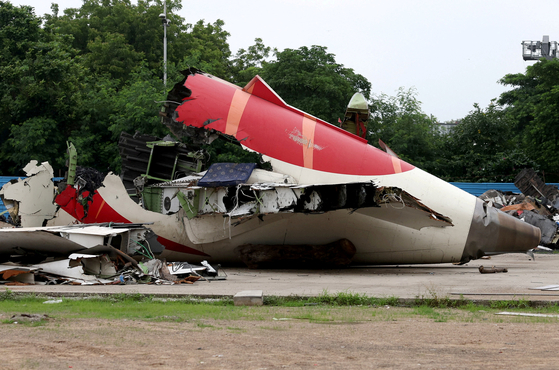 Wreckage of the Air India Boeing 787-8 Dreamliner plane sits on the open ground, outside Sardar Vallabhbhai Patel International Airport, where it took off and crashed nearby shortly afterwards, in Ahmedabad, India, on July 12. [REUTERS/YONHAP]