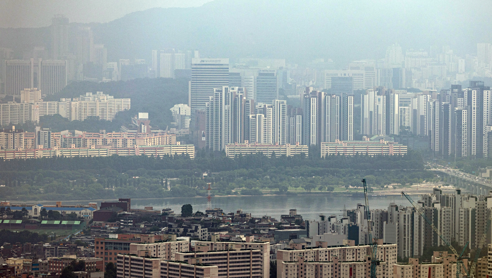 Apartment complexes are seen from Mount Namsan in central Seoul on July 7. [NEWS1]