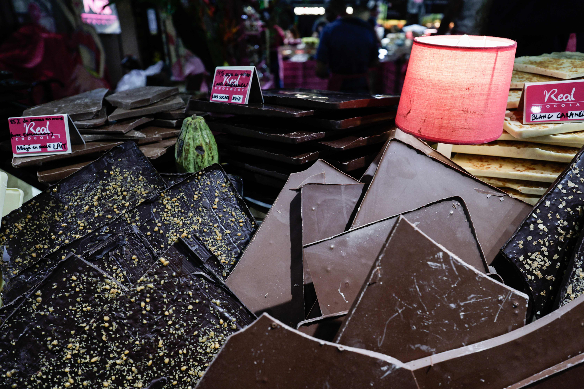 Chocolates are seen on display on a stand during the opening day of the Salon du Chocolat de Paris 2024 in Paris on October 29, 2024. Last week, a French parliamentary committee added an amendment to the Social Security Financing Act for 2025 that taxes processed food products relative to sugar content. In mid-October 2024, the Institut Montaigne recommended in a report that taxes on various sweet products should be established at 20 percent across the board to finance the fight against food insecurity. [AFP/YONHAP]