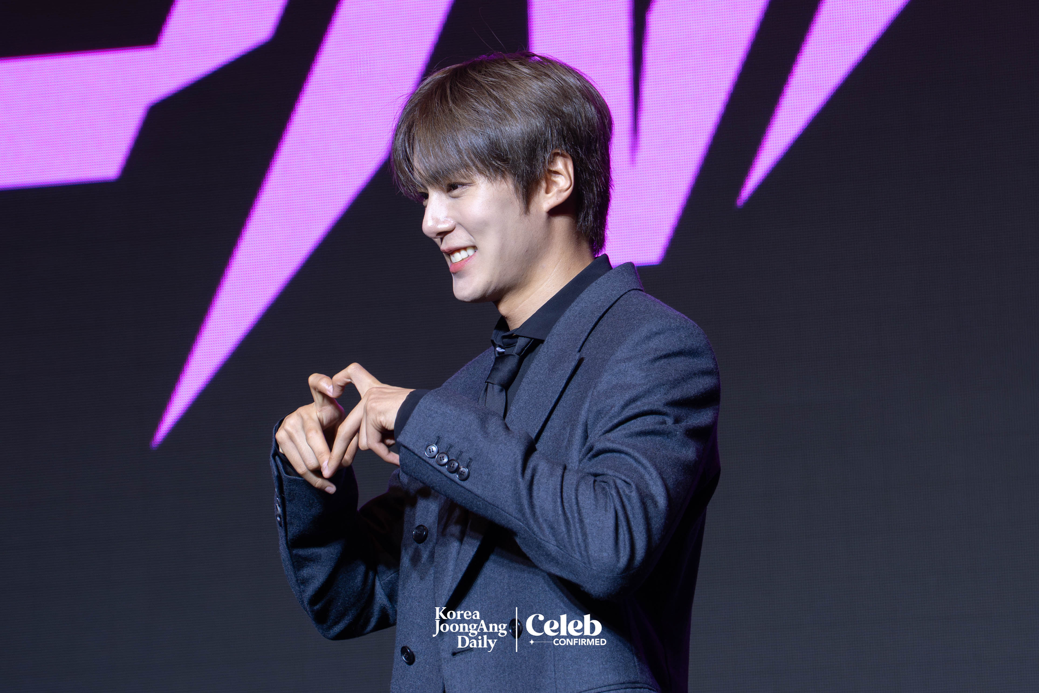 Monsta X’s Minhyuk poses for photos during a press conference ahead of the band's upcoming 10th anniversary concert, “2025 Monsta X Connect X,” at the Conrad Hotel in western Seoul on July 16. [DANIELA GONZALEZ PEREZ]