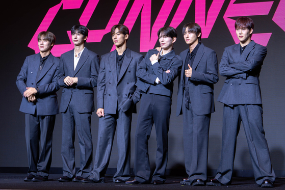 Monsta X poses for photos during a press conference in western Seoul on July 16, ahead of its 10th anniversary concert. [DANIELA GONZALEZ PEREZ]