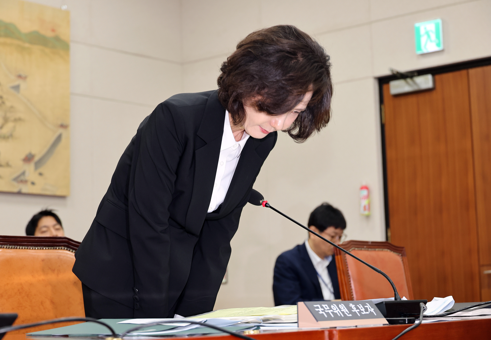 Lee Jin-sook, nominee for education minister, bows her head in apology at a confirmation hearing before the National Assembly in western Seoul on July 16. [YONHAP]