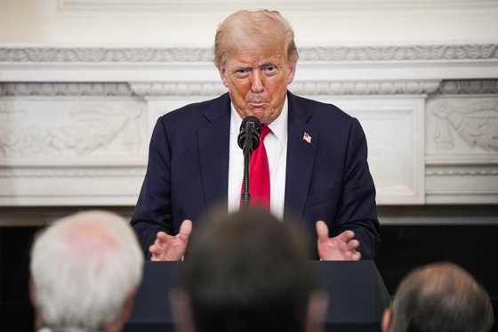 U.S. President Donald Trump participates in the White House Faith Office Luncheon in the State Dining Room at the White House in Washington on July 14. [EPA/YONHAP] 