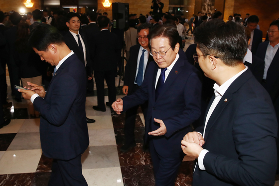 President Lee Jae-myung, then-Democratic Party leader, heads to the main chamber of the National Assembly in Yeouido, western Seoul, on Sept. 26, 2024, after attending an emergency rally held by opposition lawmakers to protest the rejection of bills including the Yellow Envelope Bill. [NEWS1]