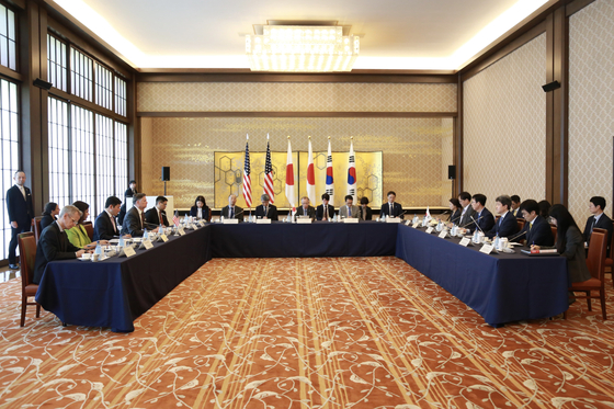 Officials from South Korea, the United States and Japan hold a trilateral meeting in Tokyo on July 18. [MINISTRY OF FOREIGN AFFAIRS]