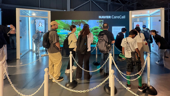 Visitors on July 11 crowd Naver Cloud's booth at the 2025 World Expo in Osaka, Japan, which opened from July 9 to 11. [YONHAP]