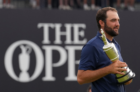 Scottie Scheffler of the United States celebrates with the Claret Jug trophy after winning The 153rd Open Championship at the Royal Portrush Golf Club in Portrush, Northern Ireland, on July 20. [REUTERS/YONHAP]
