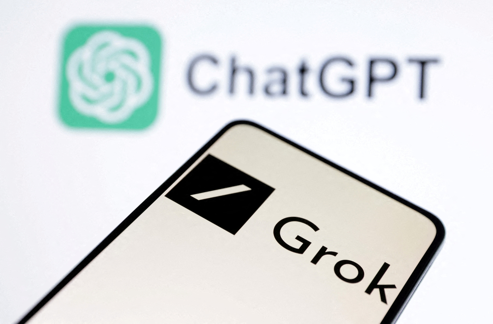 xAI Grok chatbot and ChatGPT logos are seen in this illustration taken, March 11, 2024. [REUTERS/YONHAP]