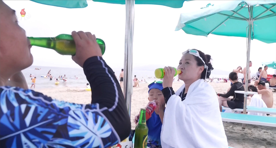 This image of tourists at the Kalma coastal tourist zone in Wonsan was captured from Korean Central Television on July 20. [YONHAP]