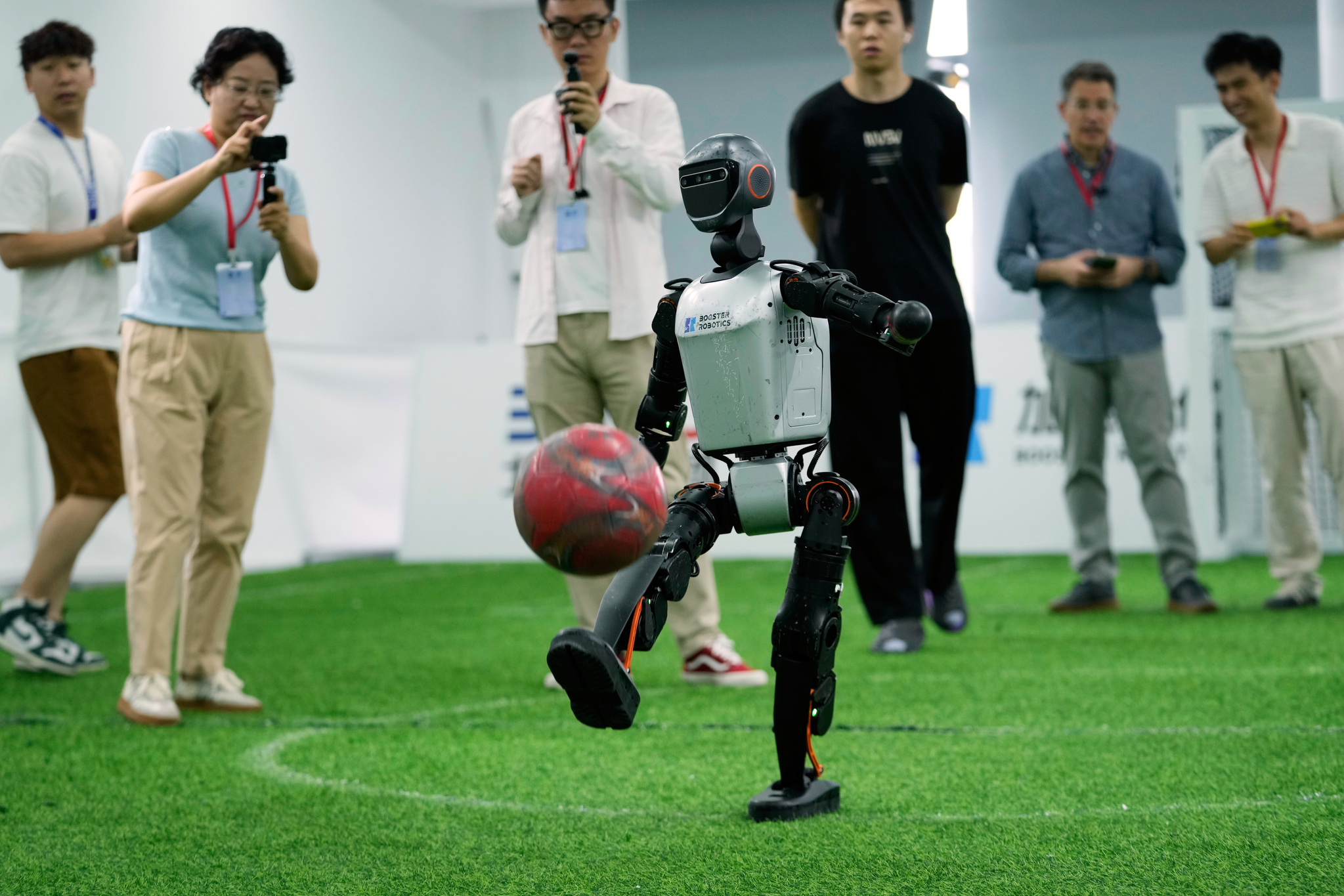 A K1 robot from Booster Robotics operates before leaving for the Brazil Robocup at a precompetition exploration camp in Beijing on July 9. [AP/YONHAP]