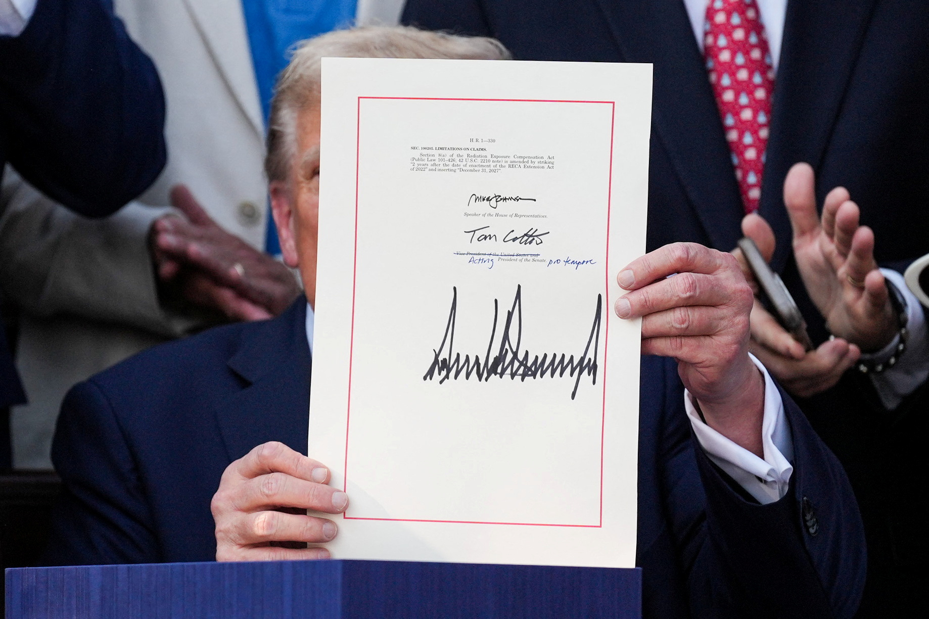 U.S. President Donald Trump presents the sweeping spending and tax legislation, known as the ″One Big Beautiful Bill Act,″ after he signed it, at the White House in Washington, D.C., U.S., July 4, 2025. [REUTERS/YONHAP]