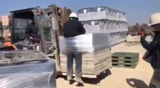 A Sri Lankan worker is tied to bricks and moved by a forklift at a brick factory in Naju, South Jeolla, on July 23. [JEONNAM MIGRANT WORKERS' HUMAN RIGHTS NETWORK]