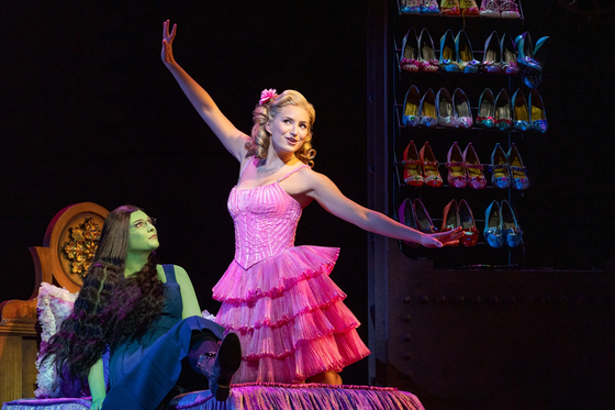 Courtney Monsma as Glinda, right, and Sheridan Adams as Elphaba perform "Popular" in the ongoing international tour production of "Wicked," which opened at the Blue Square theater in Yongsan District, central Seoul, on July 12. [JEFF BUSBY/SNCO]