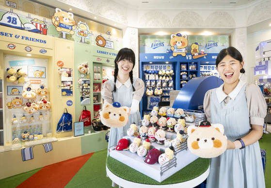 Everland employees showcase limited-edition KBO-themed merchandise from the "Lessey and Friends" seoson 2 series at the KBO pop-up store in Everland, Yongin, Gyeonggi, on July 24. The company said on the same day the series has sold over 60,000 items in just a month since its release. [Samsung C&T Resort Division]