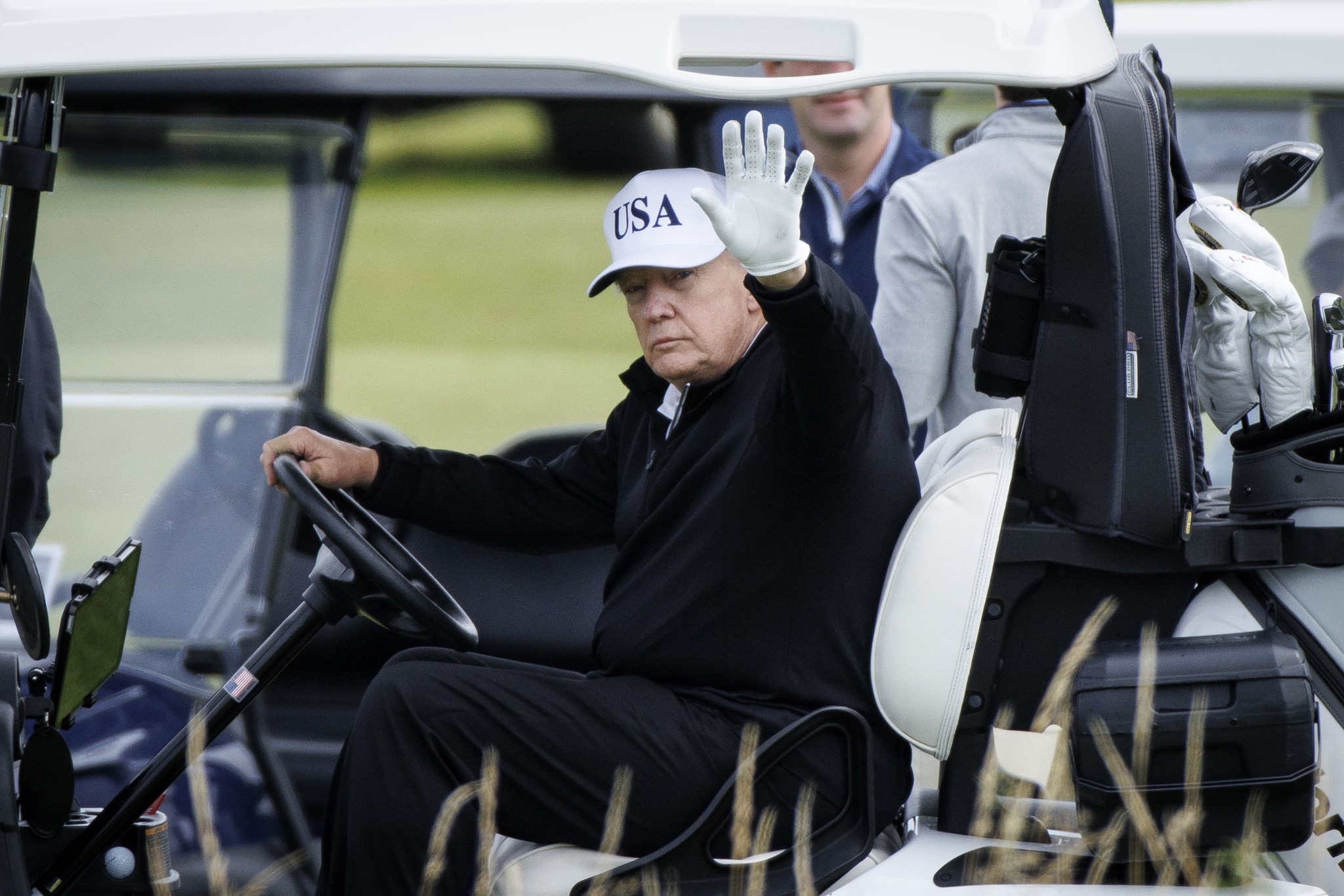 U.S. President Donald Trump waves as he plays at Trump Turnberry golf course during a private visit in Turnberry, Scotland, on July 26. [EPA/YONHAP]