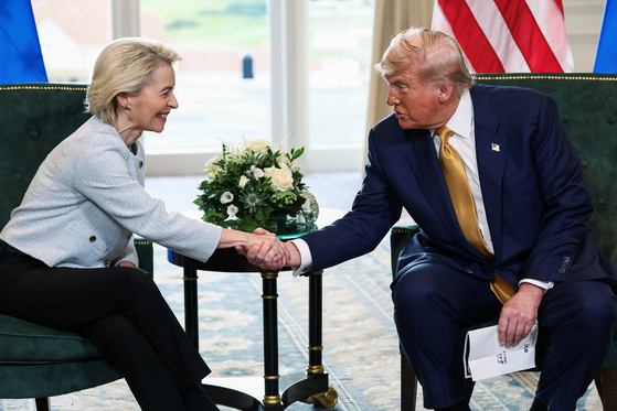 U.S. President Donald Trump shakes hands with European Commission President Ursula von der Leyen, after an announcement of a trade deal between the two in Turnberry, Scotland, on July 27. [REUTERS/YONHAP]