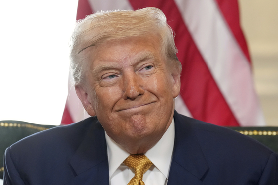 U.S. President Donald Trump reacts after reaching a trade deal with European Commission President Ursula von der Leyen at the Trump Turnberry golf course in Turnberry, Scotland, on July 27. [AP/YONHAP]