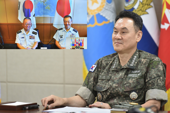 In this photo provided by South Korea's Joint Chiefs of Staff (JCS), JCS Chairman Adm. Kim Myung-soo speaks on a video call with Gen. Hiroaki Uchikura, the incoming chief of the Japanese defense ministry's Joint Staff, and the outgoing Gen. Yoshihide Yoshida, on July 29. [JOINT CHIEFS OF STAFF]