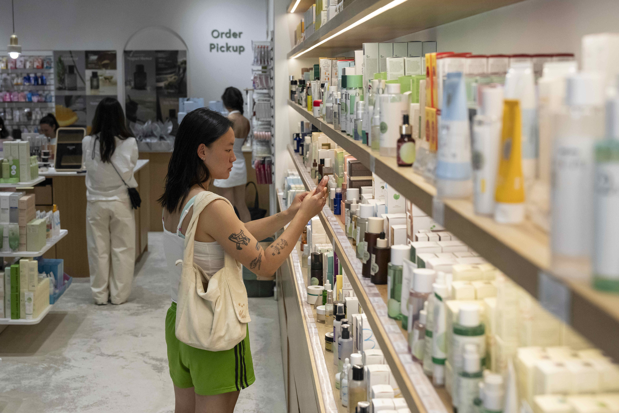 A customer checks out beauty products at a Senti Senti store in New York on July 25. [AP/YONHAP]