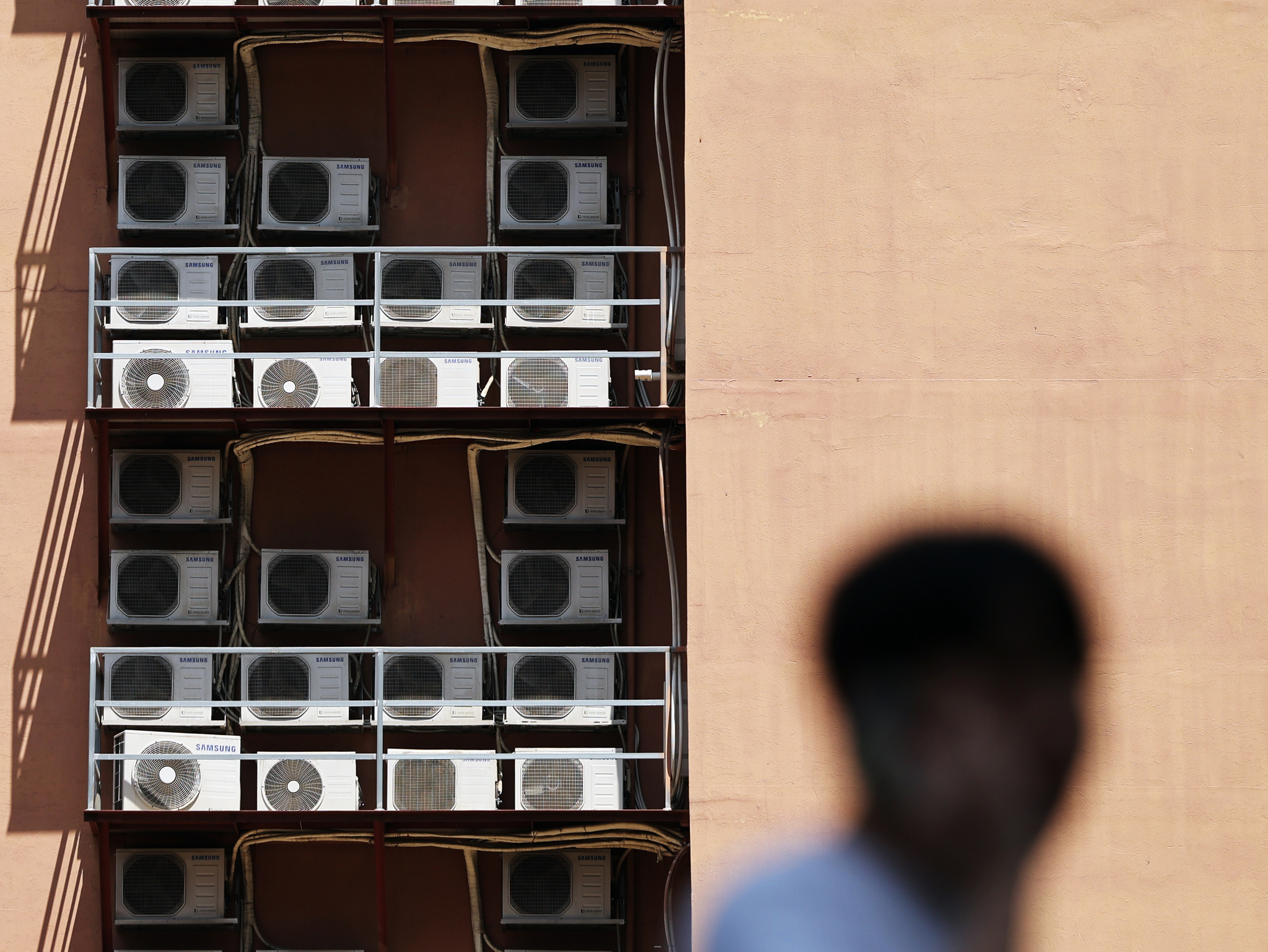 Multiple air conditioning units operate outside a building in central Seoul on July 8. [NEWS1] 