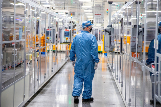 An employee inspects the battery production process at LG Energy Solution's plant in Holland, Michigan on June 1. [LG ENERGY SOLUTION]