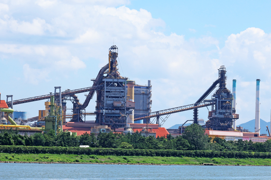 This undated file photo shows Posco Holdings' No. 1 blast furnace, right, and No. 2 blast furnace at its integrated steel mill in Pohang. [POSCO]