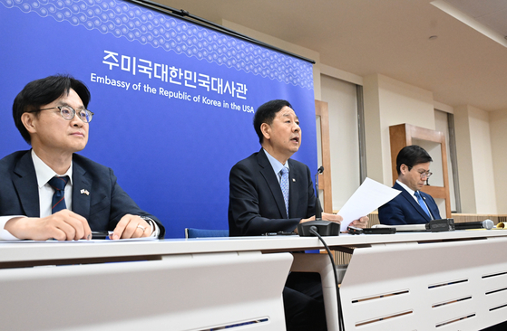 Deputy Prime Minister and Finance Minister Koo Yun-cheol delivers a statement during a briefing on Korea-U.S. trade talks at the Korean Embassy in Washington on July 30. From left are Industry Minister Kim Jung-kwan, Finance Minister Koo, and Trade Minister Yeo Han-koo. [MINISTRY OF ECONOMY AND FINANCE]