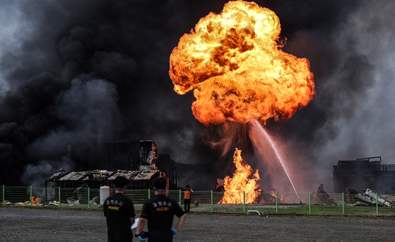 A fire breaks out at a chemical manufacturing plant in Yeongcheon, North Gyeongsang, on Aug. 3. According to the North Gyeongsang Fire Department, the blaze began around 12:43 p.m. at a cosmetics ingredient manufacturing facility in the Chaesin Industrial Complex in Geumho-eup. As of 3:30 p.m., one man had suffered severe burns to his face, and two others received minor injuries. One employee remains unaccounted for. [YONHAP] 