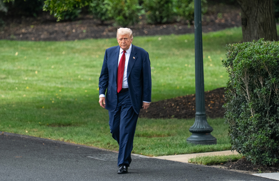U.S. President Donald Trump walks to speak to the press at the White House in Washington on Aug. 1.  [XINHUA/YONHAP]