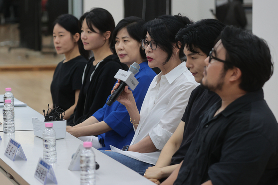 Director Yona Kim, third from right, delivers opening remarks during an open rehearsal and press roundtable for "Shimcheong" at the National Theater of Korea in central Seoul on July 30. [YONHAP]