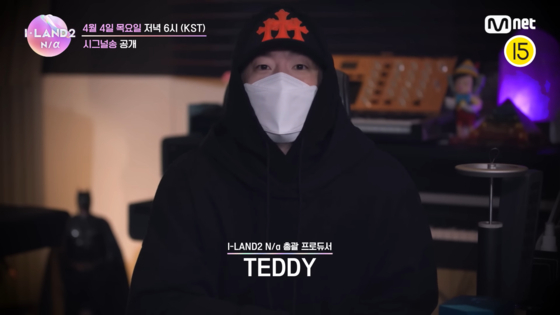 Teddy and producers from his The Black Label took part in Mnet's ″I-Land2: N/a″ (2024) audition program as producers, and were also involved in producing music for izna, the girl group launched through the show. [SCREEN CAPTURE]