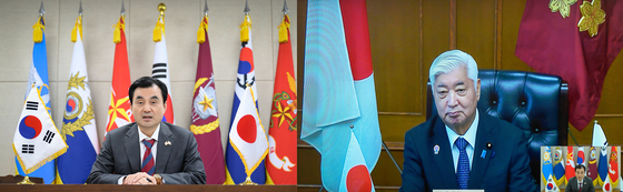 Defense Minister Ahn Gyu-back, left, and his Japanese counterpart, Gen Nakatani, hold a phone conversation via teleconference on Aug. 7, 2025. [YONHAP]