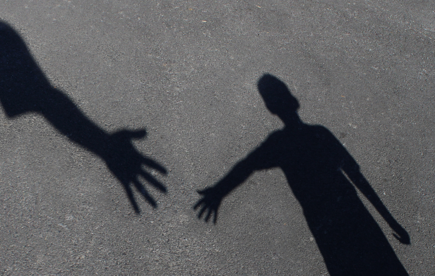 An image shows a child reaching out to seek help. [SHUTTERSTOCK]