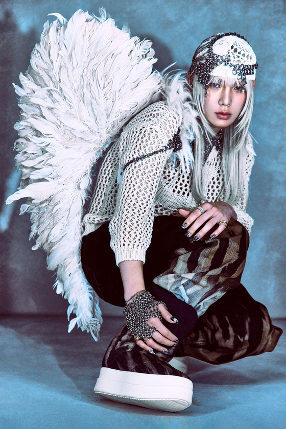 A promotional image for singer Key's third full-length album, ″Hunter″ [SM ENTERTAINMENT]