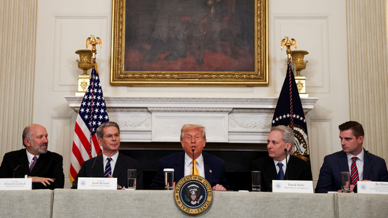 U.S. President Donald Trump speaks as Crypto czar David Sacks, U.S. Treasury Secretary Scott Bessent, U.S. Commerce Secretary Howard Lutnick, and Executive Director of the Presidential Council of Advisers for Digital Assets Bo Hines attend the White House Crypto Summit at the White House in Washington on March 7. [REUTERS/YONHAP]