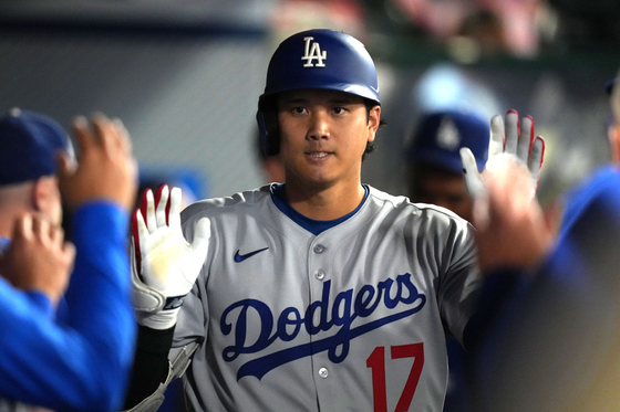 Los Angeles Dodgers designated hitter Shohei Ohtani celebrates with teammates after hitting a home run in the eighth inning against the Los Angeles Angels at Angel Stadium on Aug.11. [REUTERS/YONHAP]  