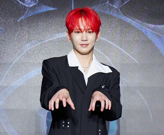 SHINee's Key poses for photos during a press conference ahead of the release of his third full-length album, ″Hunter,″ in eastern Seoul on Aug. 11. [SM ENTERTAINMENT]