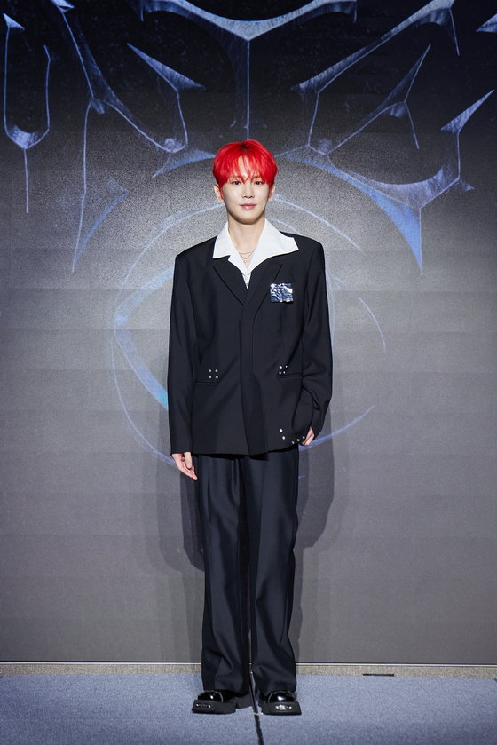 SHINee's Key poses for photos during a press conference ahead of the release of his third full-length album, ″Hunter,″ in eastern Seoul on Aug. 11. [SM ENTERTAINMENT]