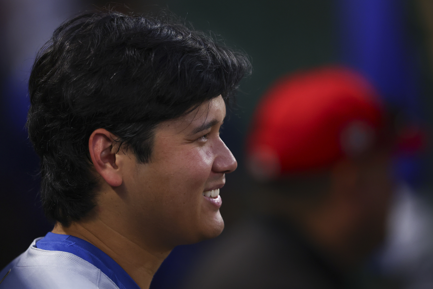 Los Angeles Dodgers designated hitter Shohei Ohtani reacts in the dugout during the fifth inning of a baseball game against the Los Angeles Angels on Aug. 11, 2025, in Anaheim, Calif. [AP/YONHAP]