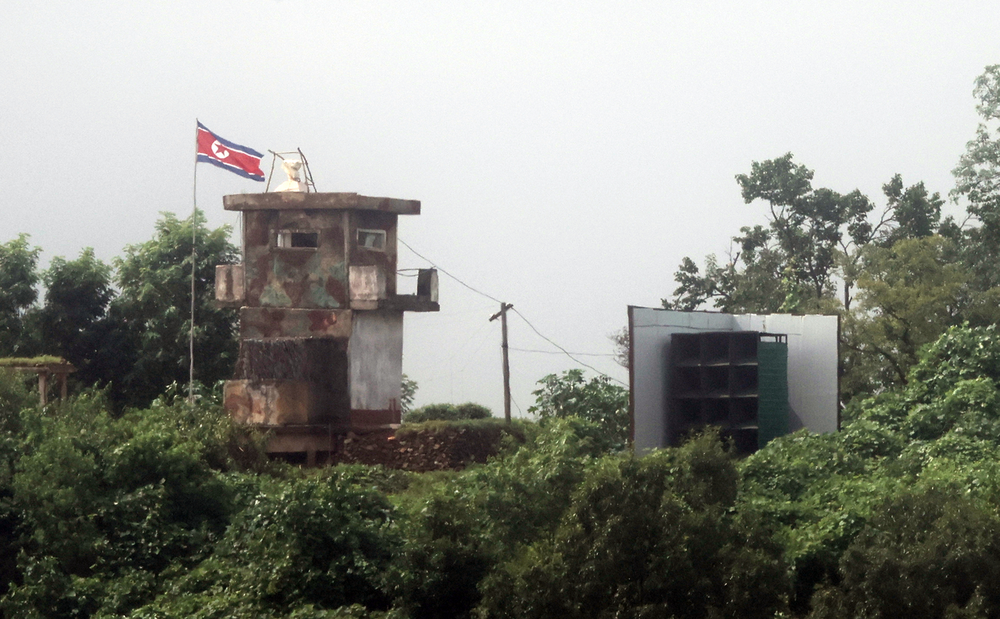 North Korea's loudspeaker aimed at the South is installed next to a North Korean guard post seen from a border area in Paju, Gyeonggi, on Aug. 14. [YONHAP]