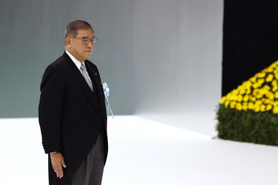 Japanese Prime Minister Shigeru Ishiba stands after giving a speech during the National Memorial Ceremony for the War Dead in Tokyo on Aug. 15, marking the 80th anniversary of the end of World War II. [EPA/YONHAP]