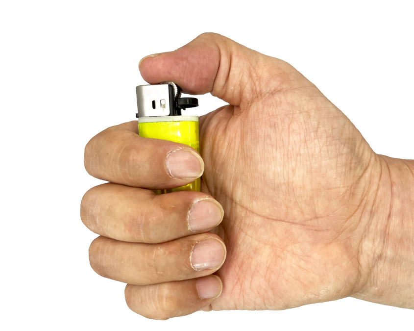 An image of a hand holding up a lighter [YONHAP]