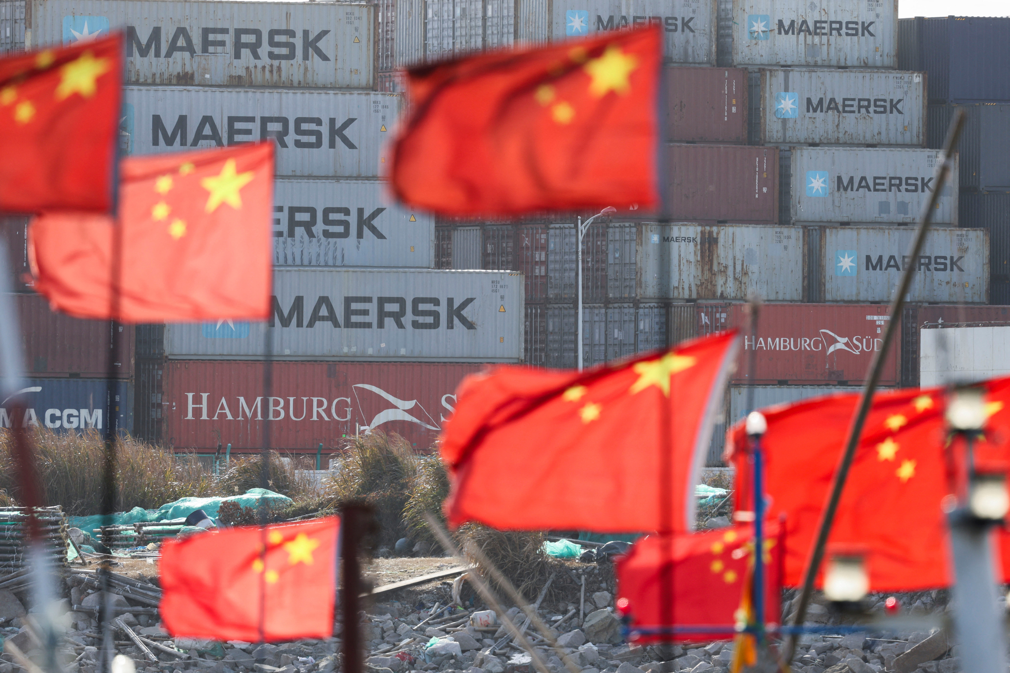 Chinese flags flutter near shipping containers at the Yangshan Port outside Shanghai, China, on Feb. 7. [REUTERS/YONHAP]
