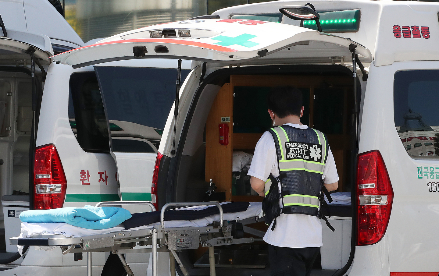 An ambulance vehicle attended by medical staff, unrelated to the story [NEWS1]