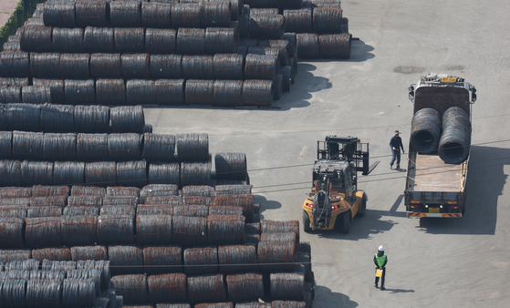 Steel products are piled up for export at a port in Pyeongtaek, Gyeonggi. [YONHAP]